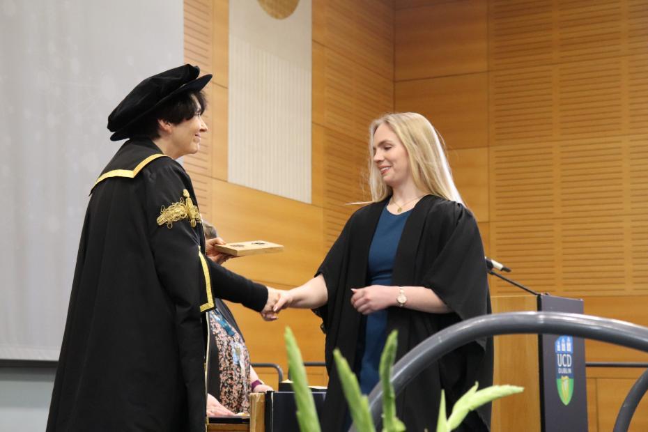 Hazel Hourihan receiving her award from UCD President Professor Orla Feely